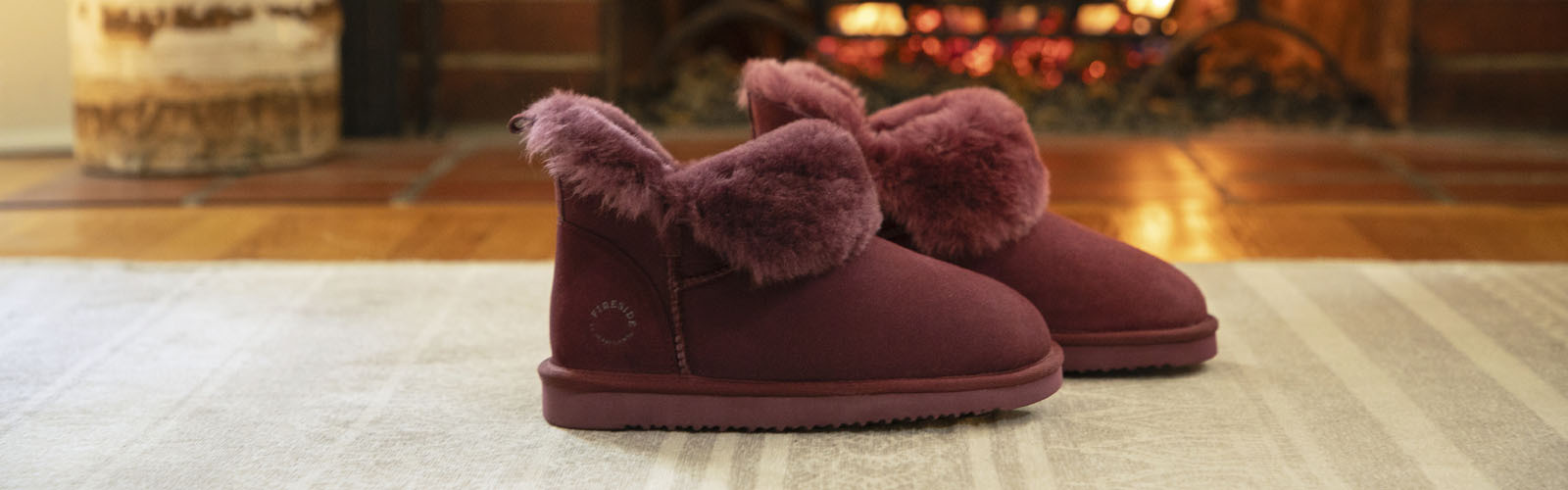 Cozy slippers near a fireplace