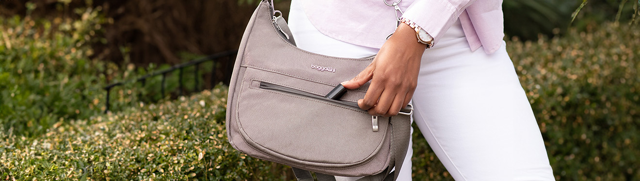 Woman holding purse in park